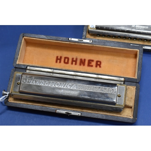 425 - TWO CASED HOHNER 64 CHROMONICA HARMONICAS, both appear complete and in good condition, in original f... 