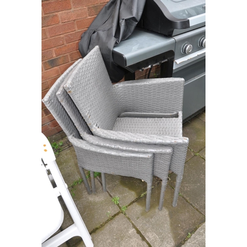 1022 - FOUR WHITE PLASTIC RECLINING GARDEN CHAIRS and three rattan style chairs with cushions (7)