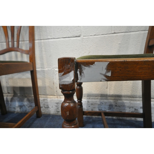 1355 - A SET OF FOUR EARLY 20TH CENTURY OAK CHAIRS, with green upholstered drop in seat pads (condition rep... 