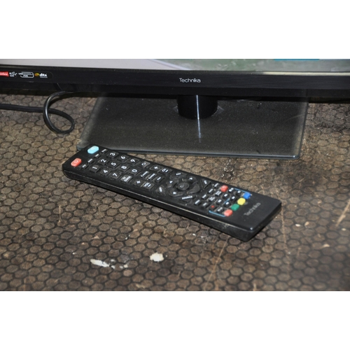 1091 - A TECHNIKA 22E21B 21.6in TV WITH REMOTE (PAT pass and working)