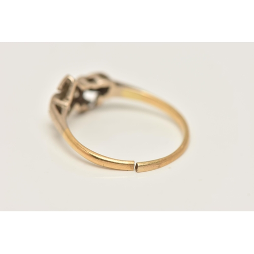 11 - A YELLOW METAL DIAMOND RING, set with a central round brilliant cut diamond, illusion set in a heart... 