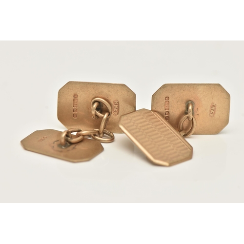 12 - A PAIR OF 9CT GOLD CUFFLINKS, rectangular form with one engine turned pattern panel, chain linked to... 