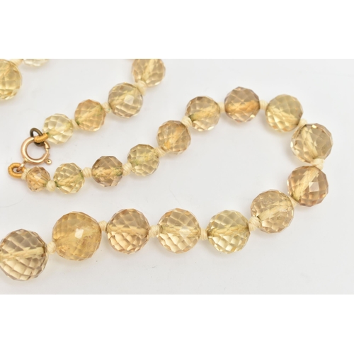 18 - A FACETED CITRINE BEAD NECKLACE, faceted round graduated citrine beads, individually knotted on a co... 