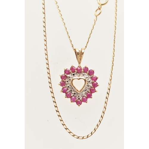 21 - A 9CT GOLD RUBY AND DIAMOND HEART PENDANT NECKLACE AND MATCHING EARRINGS, the pendant of an open wor... 