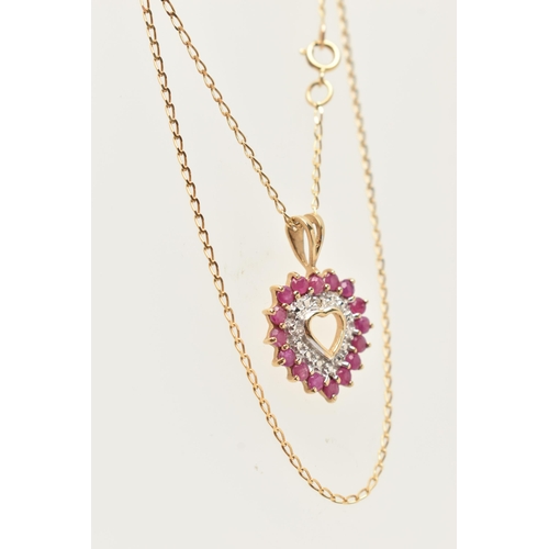 21 - A 9CT GOLD RUBY AND DIAMOND HEART PENDANT NECKLACE AND MATCHING EARRINGS, the pendant of an open wor... 