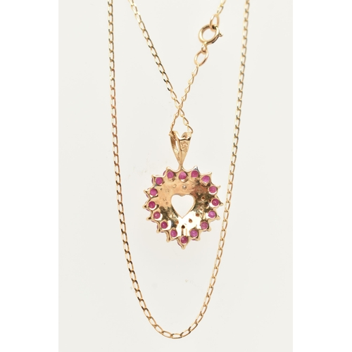 21 - A 9CT GOLD RUBY AND DIAMOND HEART PENDANT NECKLACE AND MATCHING EARRINGS, the pendant of an open wor... 