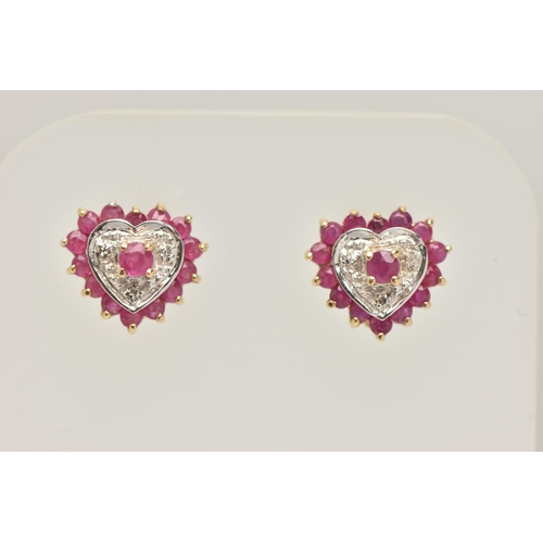 21 - A 9CT GOLD RUBY AND DIAMOND HEART PENDANT NECKLACE AND MATCHING EARRINGS, the pendant of an open wor... 