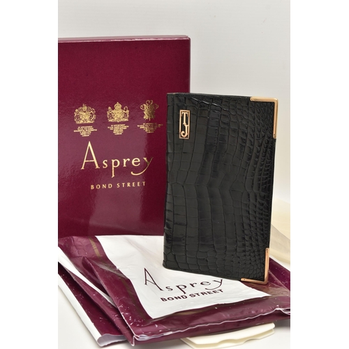 26 - AN 'ASPREY LONDON' 9CT GOLD MOUNTED CROCODILE SKIN WALLET, of a rectangular form, displaying the ini... 