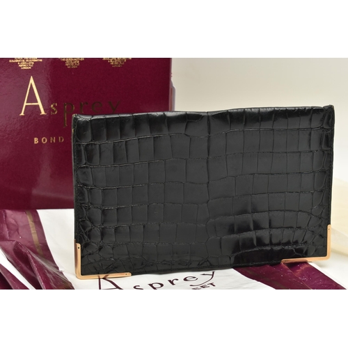 26 - AN 'ASPREY LONDON' 9CT GOLD MOUNTED CROCODILE SKIN WALLET, of a rectangular form, displaying the ini... 