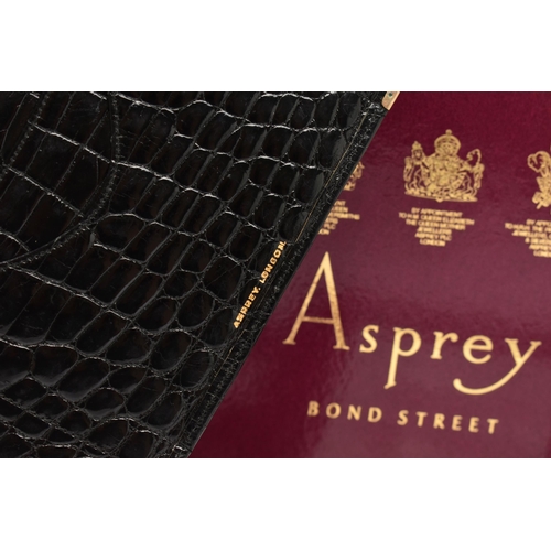 26 - AN 'ASPREY LONDON' 9CT GOLD MOUNTED CROCODILE SKIN WALLET, of a rectangular form, displaying the ini... 