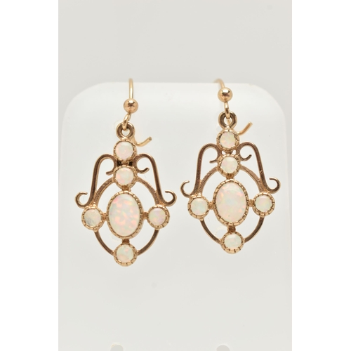 27 - A PAIR OF 9CT GOLD SYNTHETIC OPAL DROP EARRINGS, each of openwork scrolling design set with a centra... 