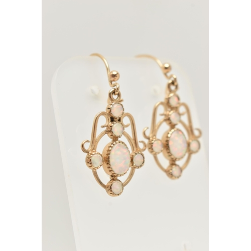 27 - A PAIR OF 9CT GOLD SYNTHETIC OPAL DROP EARRINGS, each of openwork scrolling design set with a centra... 