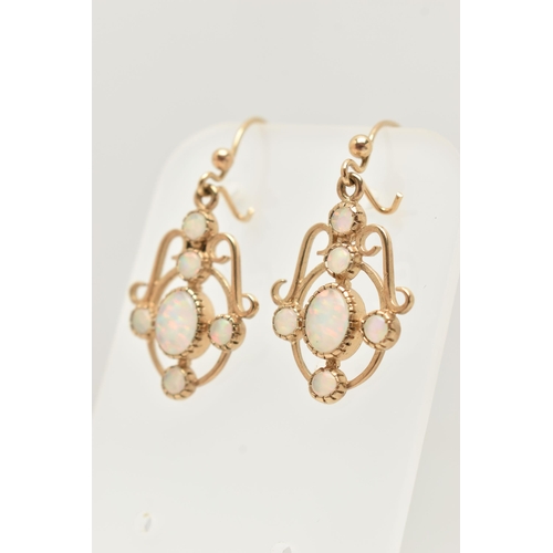 27 - A PAIR OF 9CT GOLD SYNTHETIC OPAL DROP EARRINGS, each of openwork scrolling design set with a centra... 