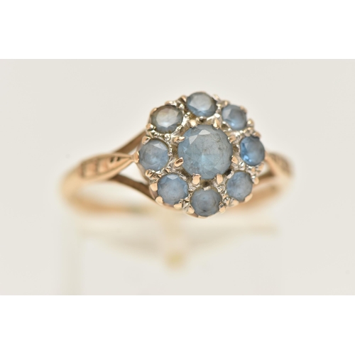 28 - A GEM SET RING, designed as a cluster of circular cut gems, assessed as synthetic blue spinel, to th... 