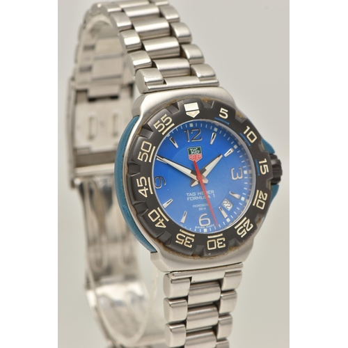 30 - A TAG HEUER FORMULA 1 QUARTZ WATCH, the blue face with Arabic and baton marker's, a date dial, lumin... 