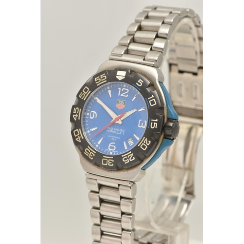 30 - A TAG HEUER FORMULA 1 QUARTZ WATCH, the blue face with Arabic and baton marker's, a date dial, lumin... 