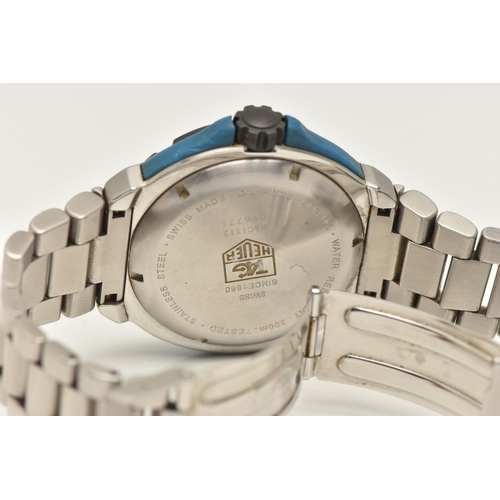 30 - A TAG HEUER FORMULA 1 QUARTZ WATCH, the blue face with Arabic and baton marker's, a date dial, lumin... 