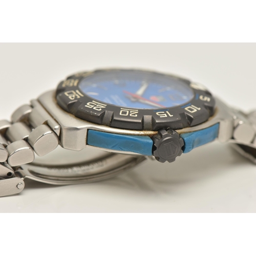 30 - A TAG HEUER FORMULA 1 QUARTZ WATCH, the blue face with Arabic and baton marker's, a date dial, lumin... 