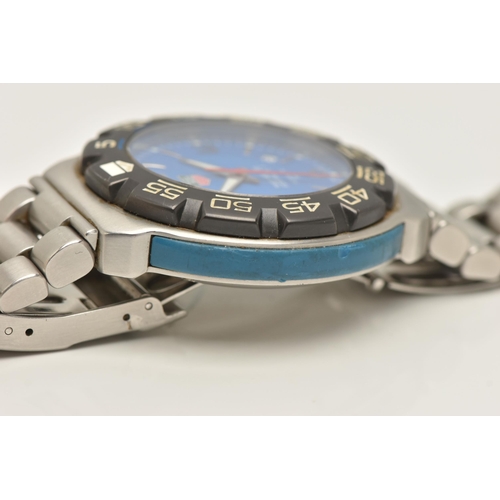 30 - A TAG HEUER FORMULA 1 QUARTZ WATCH, the blue face with Arabic and baton marker's, a date dial, lumin... 