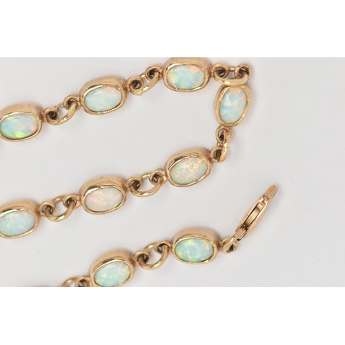 31 - A 9CT GOLD OPAL BRACELET, each link designed as an oval opal cabochon in a collet setting, to the sp... 