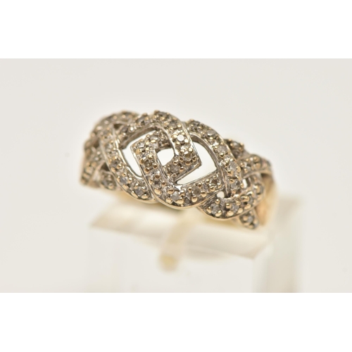 33 - A 9CT YELLOW GOLD DIAMOND DRESS RING, designed as a series of interwoven lines set with diamonds, to... 