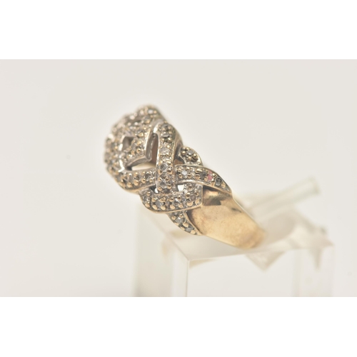 33 - A 9CT YELLOW GOLD DIAMOND DRESS RING, designed as a series of interwoven lines set with diamonds, to... 