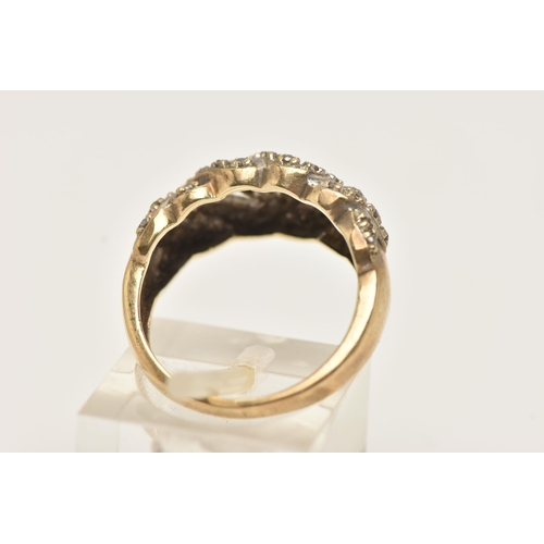 33 - A 9CT YELLOW GOLD DIAMOND DRESS RING, designed as a series of interwoven lines set with diamonds, to... 