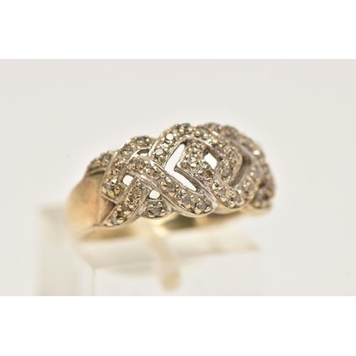 33 - A 9CT YELLOW GOLD DIAMOND DRESS RING, designed as a series of interwoven lines set with diamonds, to... 