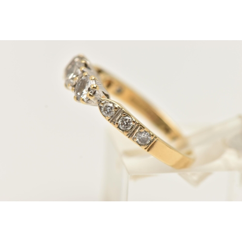 36 - AN 18CT GOLD THREE STONE DIAMOND RING, designed as three brilliant cut diamonds with three diamonds ... 