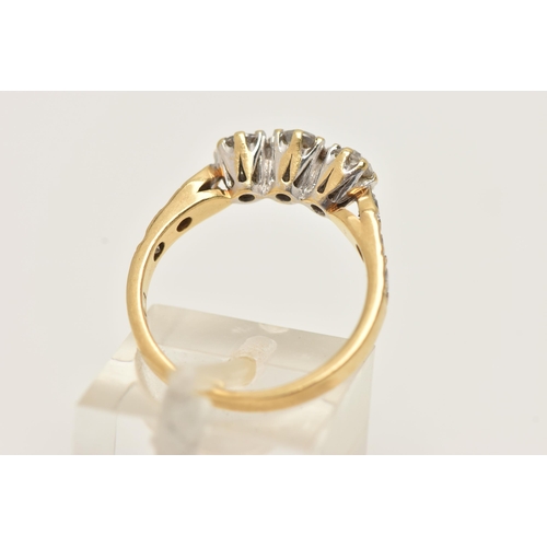 36 - AN 18CT GOLD THREE STONE DIAMOND RING, designed as three brilliant cut diamonds with three diamonds ... 