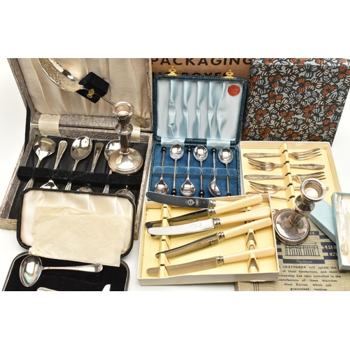 82 - A BOX OF ASSORTED WHITE METAL WARE, to include a pair of silver candle sticks on round weighted base... 