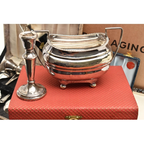 82 - A BOX OF ASSORTED WHITE METAL WARE, to include a pair of silver candle sticks on round weighted base... 