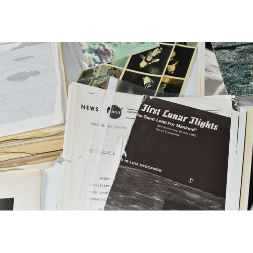 311 - A BOX OF DOCUMENTS RELATING TO THE APOLLO 11 MISSION comprising a number of black and white photos a... 