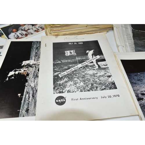 311 - A BOX OF DOCUMENTS RELATING TO THE APOLLO 11 MISSION comprising a number of black and white photos a... 