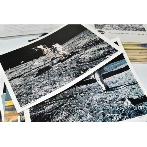 311 - A BOX OF DOCUMENTS RELATING TO THE APOLLO 11 MISSION comprising a number of black and white photos a... 