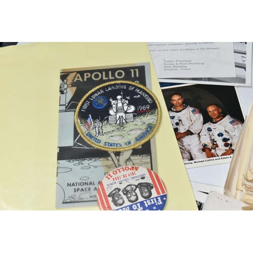 311 - A BOX OF DOCUMENTS RELATING TO THE APOLLO 11 MISSION comprising a number of black and white photos a... 