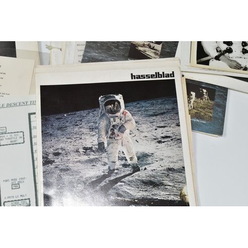 311 - A BOX OF DOCUMENTS RELATING TO THE APOLLO 11 MISSION comprising a number of black and white photos a... 