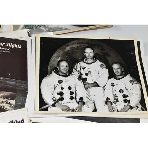 311 - A BOX OF DOCUMENTS RELATING TO THE APOLLO 11 MISSION comprising a number of black and white photos a... 