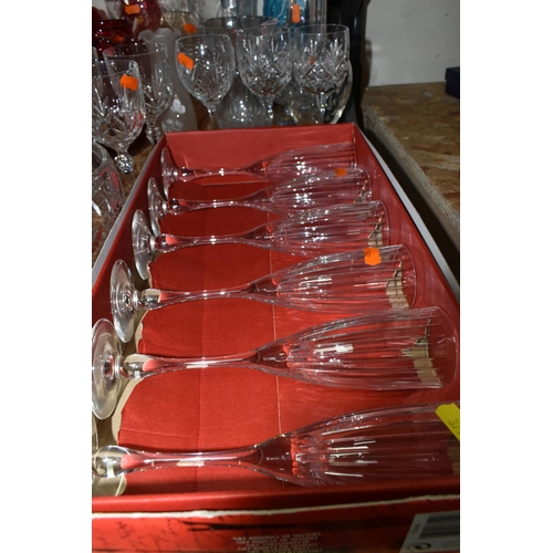 379 - A GROUP OF CLEAR AND COLOURED MOSTLY CRYSTAL CUT GLASS to include a box of six Polaris wine flutes, ... 