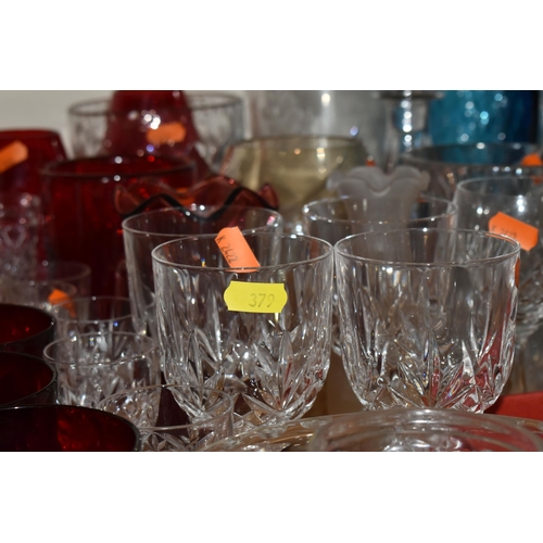 379 - A GROUP OF CLEAR AND COLOURED MOSTLY CRYSTAL CUT GLASS to include a box of six Polaris wine flutes, ... 