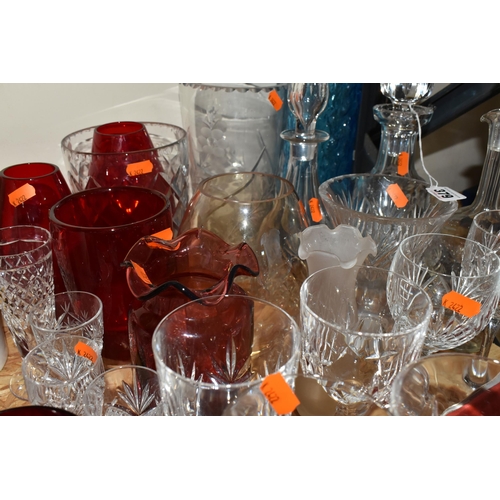 379 - A GROUP OF CLEAR AND COLOURED MOSTLY CRYSTAL CUT GLASS to include a box of six Polaris wine flutes, ... 