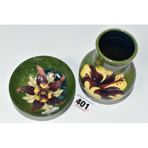 401 - TWO PIECES OF MOORCROFT POTTERY, comprising a small baluster vase in Hibiscus pattern on a green-blu... 