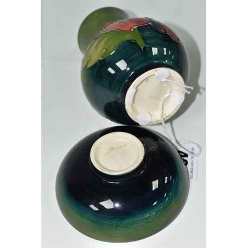 401 - TWO PIECES OF MOORCROFT POTTERY, comprising a small baluster vase in Hibiscus pattern on a green-blu... 