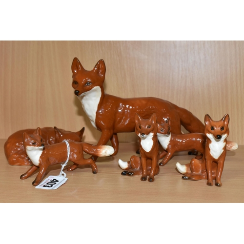 403 - SIX BESWICK FOX FIGURES, comprising Fox - Standing, model no 1016A, height 13cm, Fox - Curled no 101... 