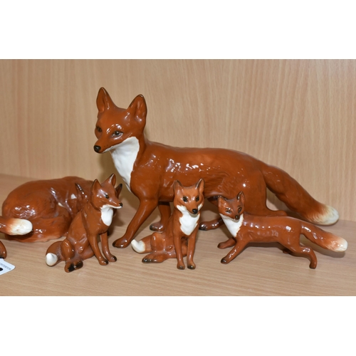 403 - SIX BESWICK FOX FIGURES, comprising Fox - Standing, model no 1016A, height 13cm, Fox - Curled no 101... 