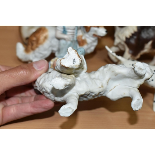 405 - A GROUP OF CERAMIC DOG FIGURES, twelve pieces comprising a large Sylvac terrier model no 1380, heigh... 