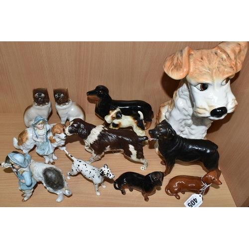 405 - A GROUP OF CERAMIC DOG FIGURES, twelve pieces comprising a large Sylvac terrier model no 1380, heigh... 