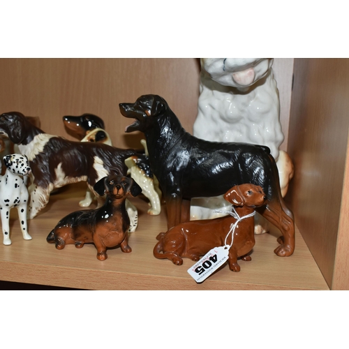 405 - A GROUP OF CERAMIC DOG FIGURES, twelve pieces comprising a large Sylvac terrier model no 1380, heigh... 