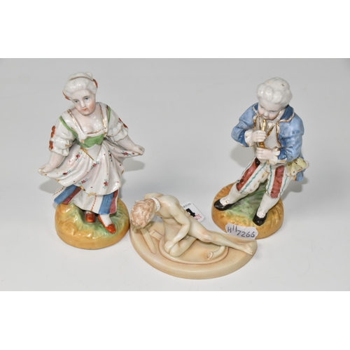 414 - THREE FIGURES, comprising a pair of continental porcelain figures, depicting a male figure playing a... 