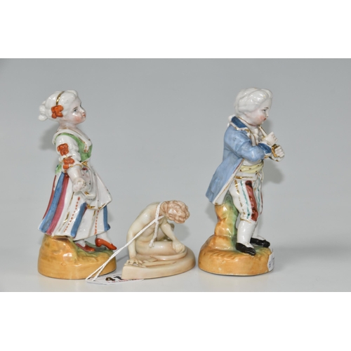 414 - THREE FIGURES, comprising a pair of continental porcelain figures, depicting a male figure playing a... 